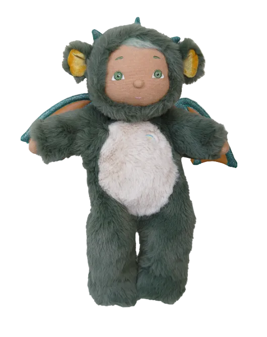 Plush toy dragon with a soft texture on a beige background