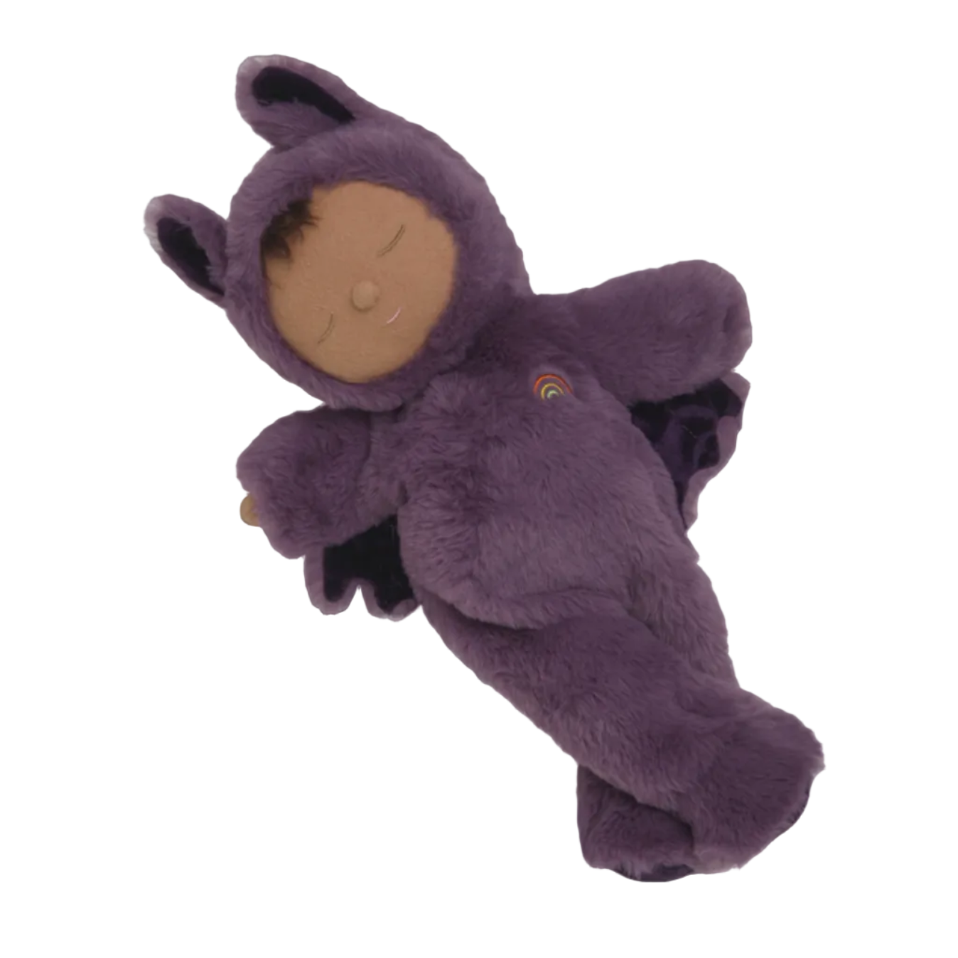 A plush baby doll wearing a fuzzy purple hooded onesie with bunny ears and a small rainbow patch on the chest, shown against a dark plum background.