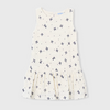Cream dress with bow pattern. 
