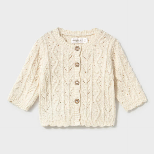 An off-white cable-knit cardigan sweater with three-quarter sleeves and a button-up front
