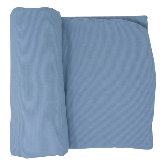 Folded blue fabric on a white background