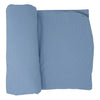 Folded blue fabric on a white background