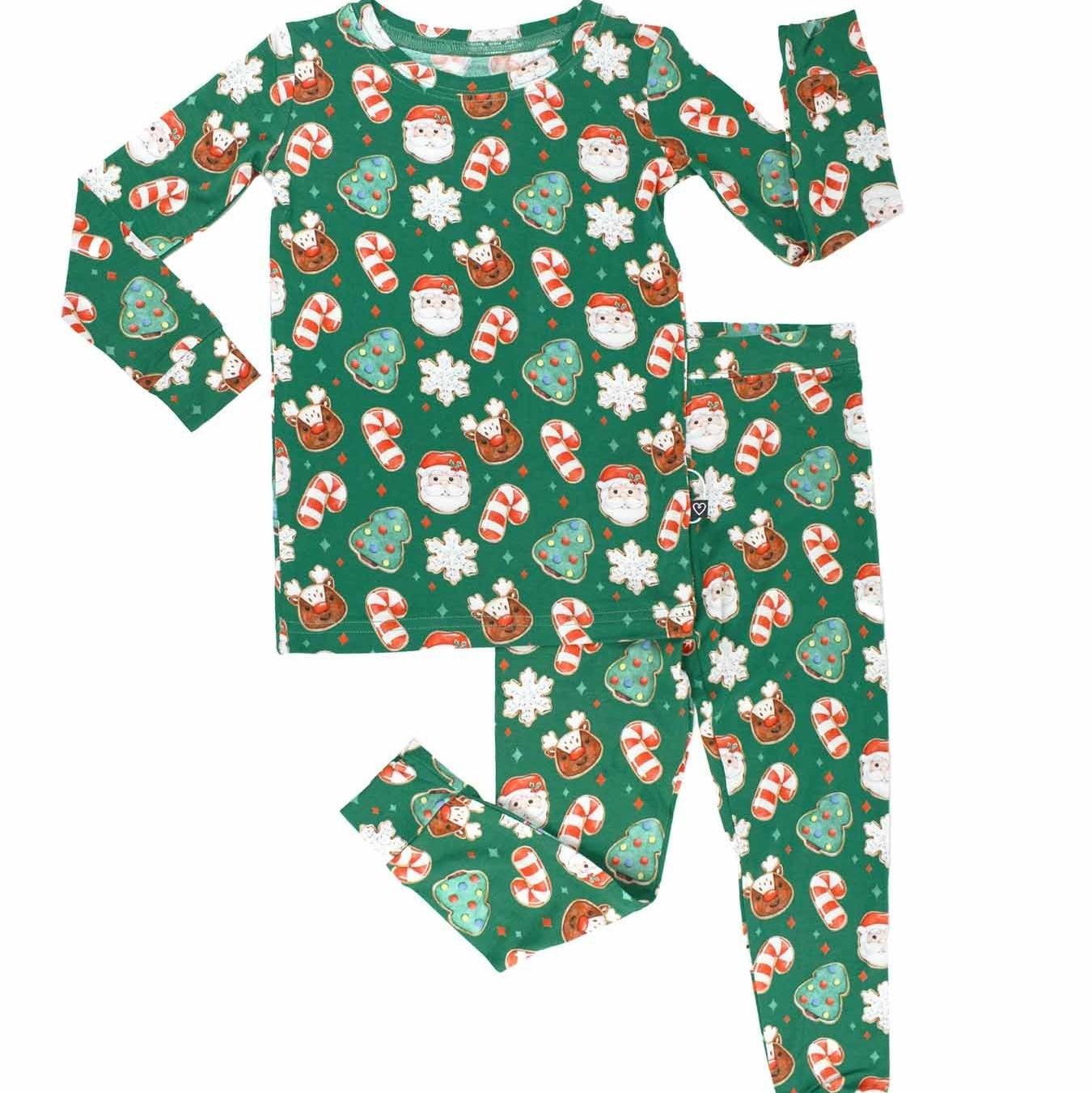 Christmas-themed pajama set with Santa Claus, reindeer, and candy cane patterns on a green background.