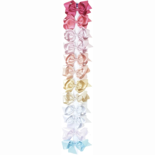 Set of colorful hair bows arranged vertically