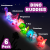 Six colorful light-up dinosaur bath toys on white background.