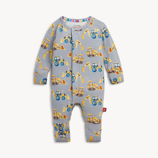 A baby long-sleeve footless one-piece romper in light gray, featuring an all-over print of yellow and blue construction vehicles and equipment.