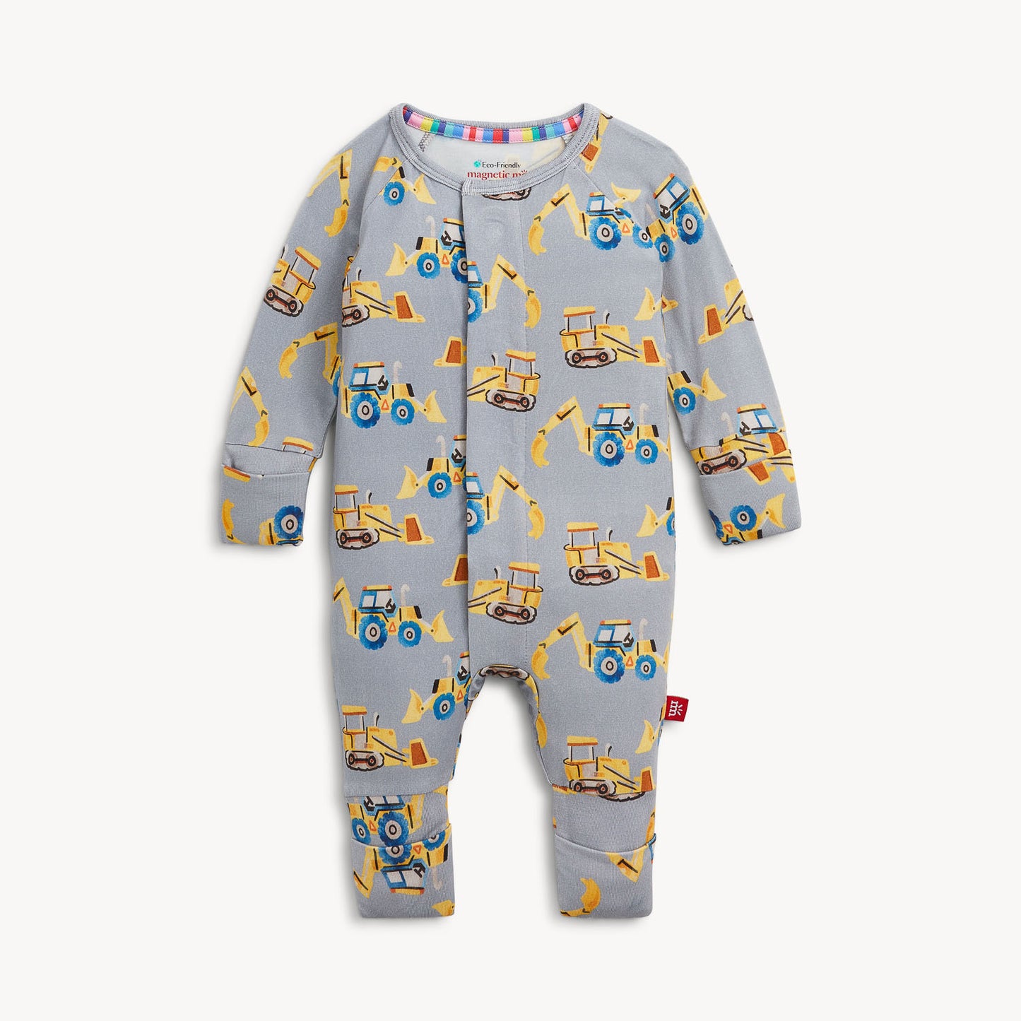 A baby long-sleeve footless one-piece romper in light gray, featuring an all-over print of yellow and blue construction vehicles and equipment.