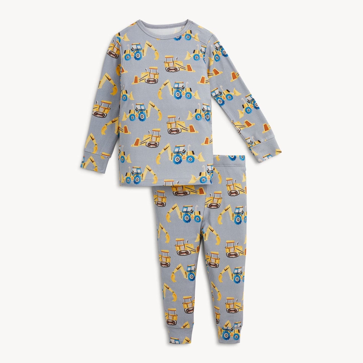 A two-piece children's pajama set featuring a light gray long-sleeve top and matching pants, both printed with a repeating pattern of yellow construction vehicles like tractors and excavators.