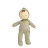Baby doll in a beige onesie with a hood on a white background