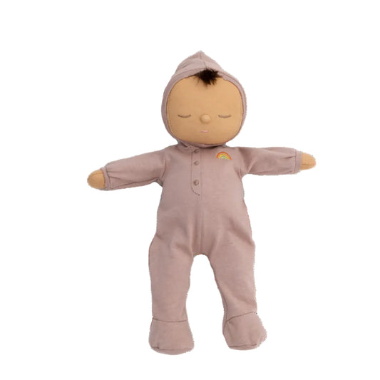 Baby doll in a pink onesie with a rainbow on a white background