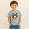 Child wearing a light blue t-shirt with a bear graphic and 'Colorado' under the bear.