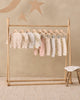Baby wearing the Dusty Rose Pant, lifestyle photo