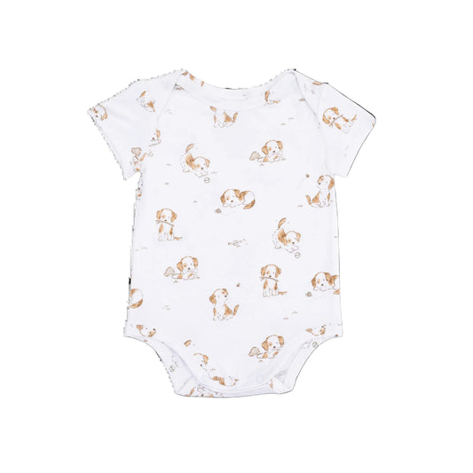 White baby onesie with brown and white dog print