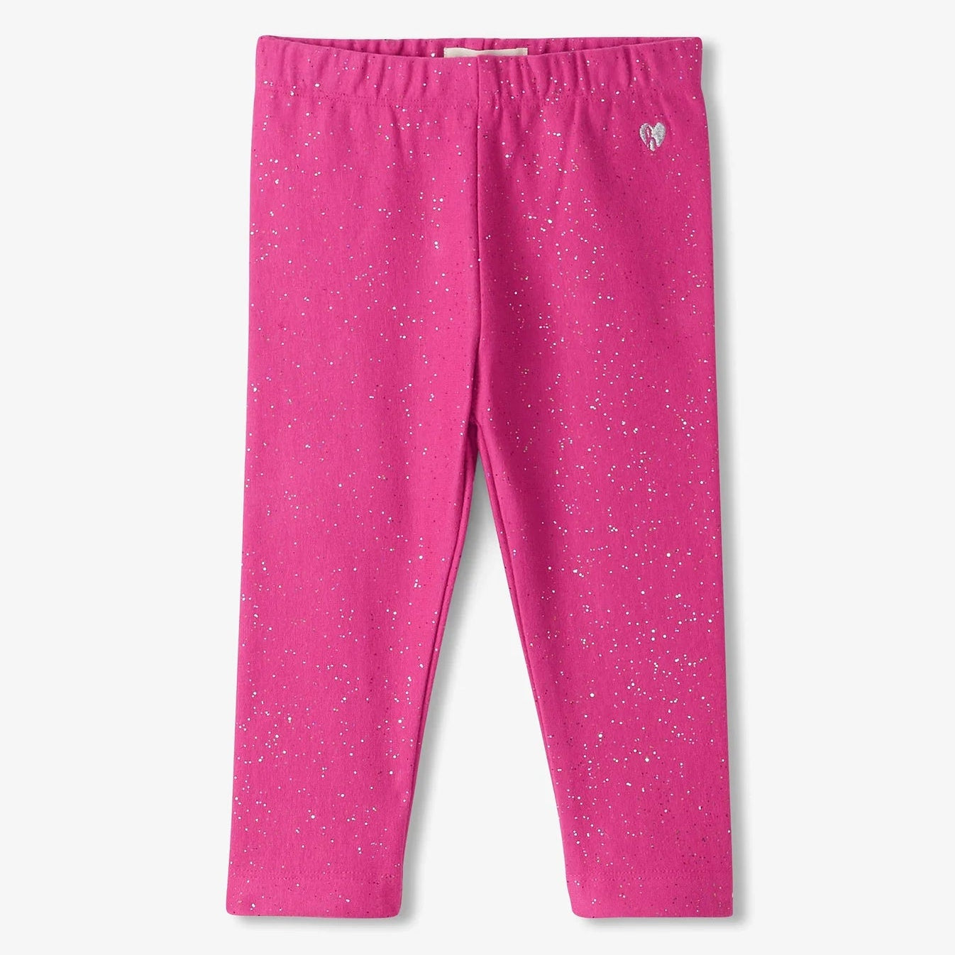 A pair of vibrant pink leggings with a speckled pattern, featuring a small heart logo at the elastic waistband.