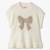Cream-colored sleeveless sweater with a butterfly design on a white background