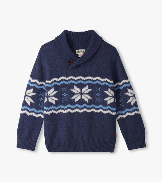 Blue sweater with snowflake pattern on a light gray background