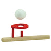 Red plastic golf hole marker with a white golf ball on a white background