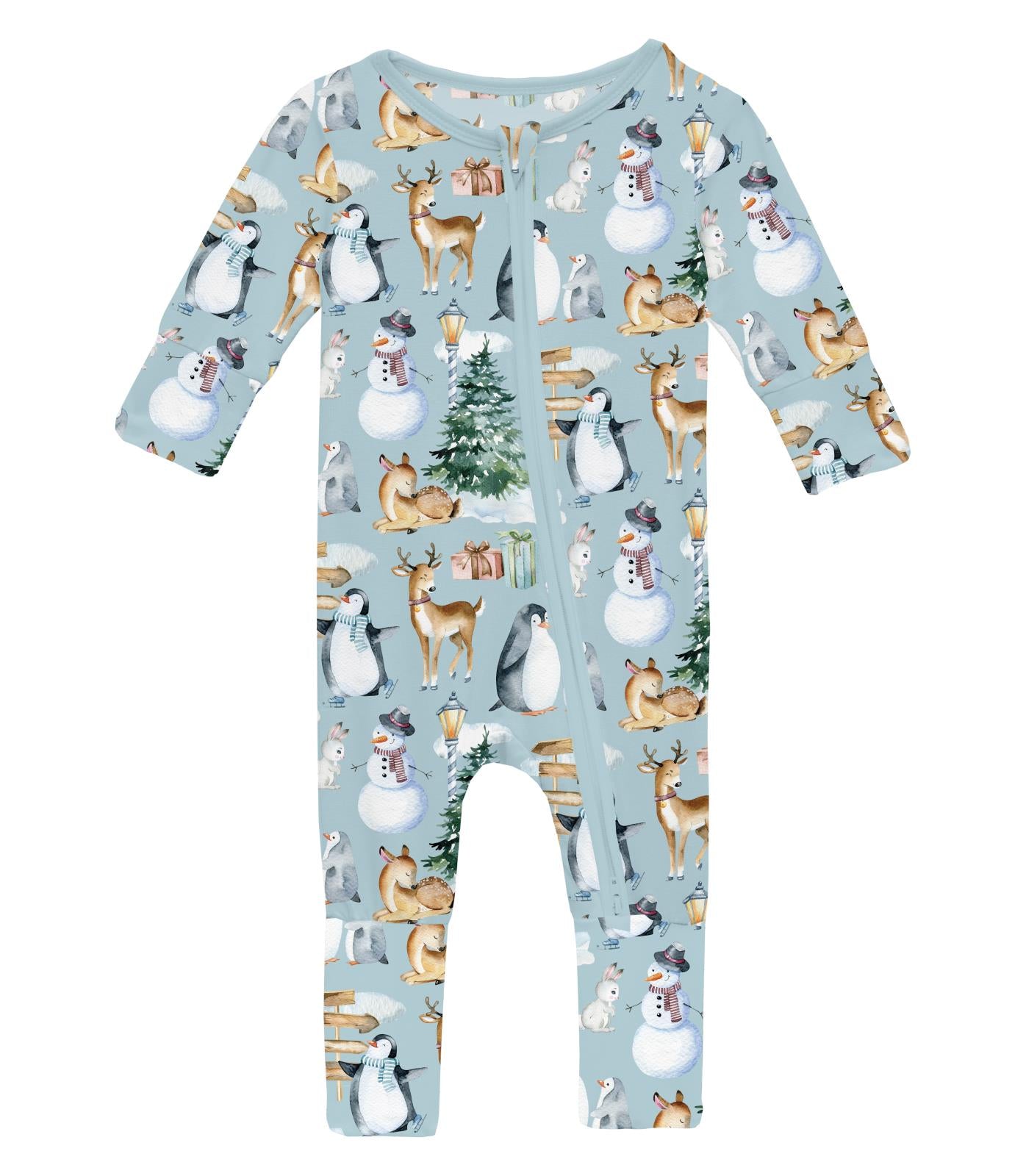 A blue baby romper with a winter woodland pattern, featuring animals such as deer and squirrels, and a Christmas tree, with a zipper at the front.