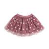 A dusty rose pink tulle tutu skirt decorated with small white embroidered flowers, shown flat against a solid white background.