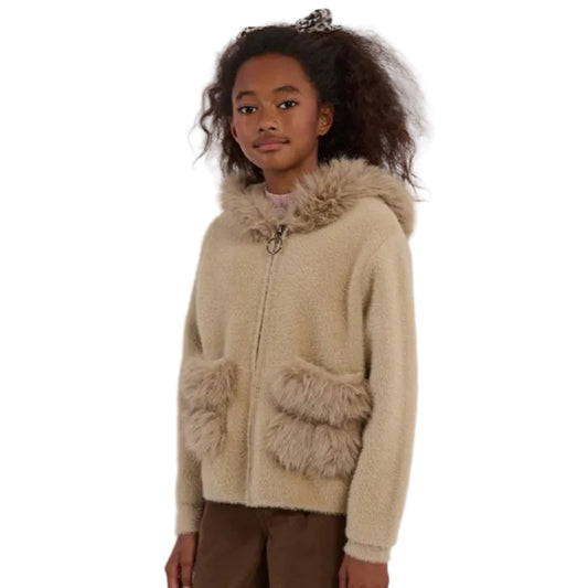 Child wearing a beige cardigan with fur trim on a white background