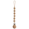 Wooden pacifier clip with beads on a white background