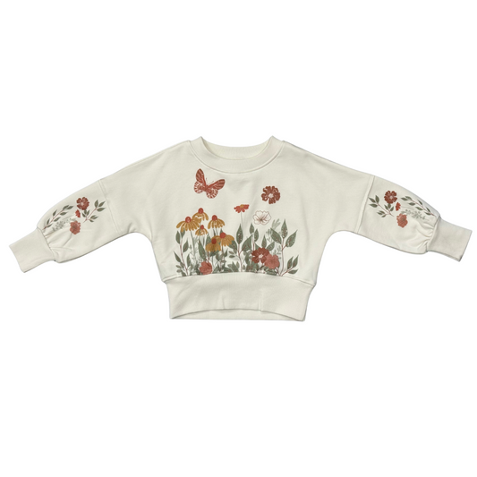 Children's sweater with floral and butterfly design on a white background