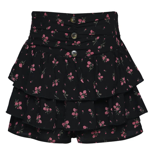 Black tiered skirt with pink floral pattern on a white background