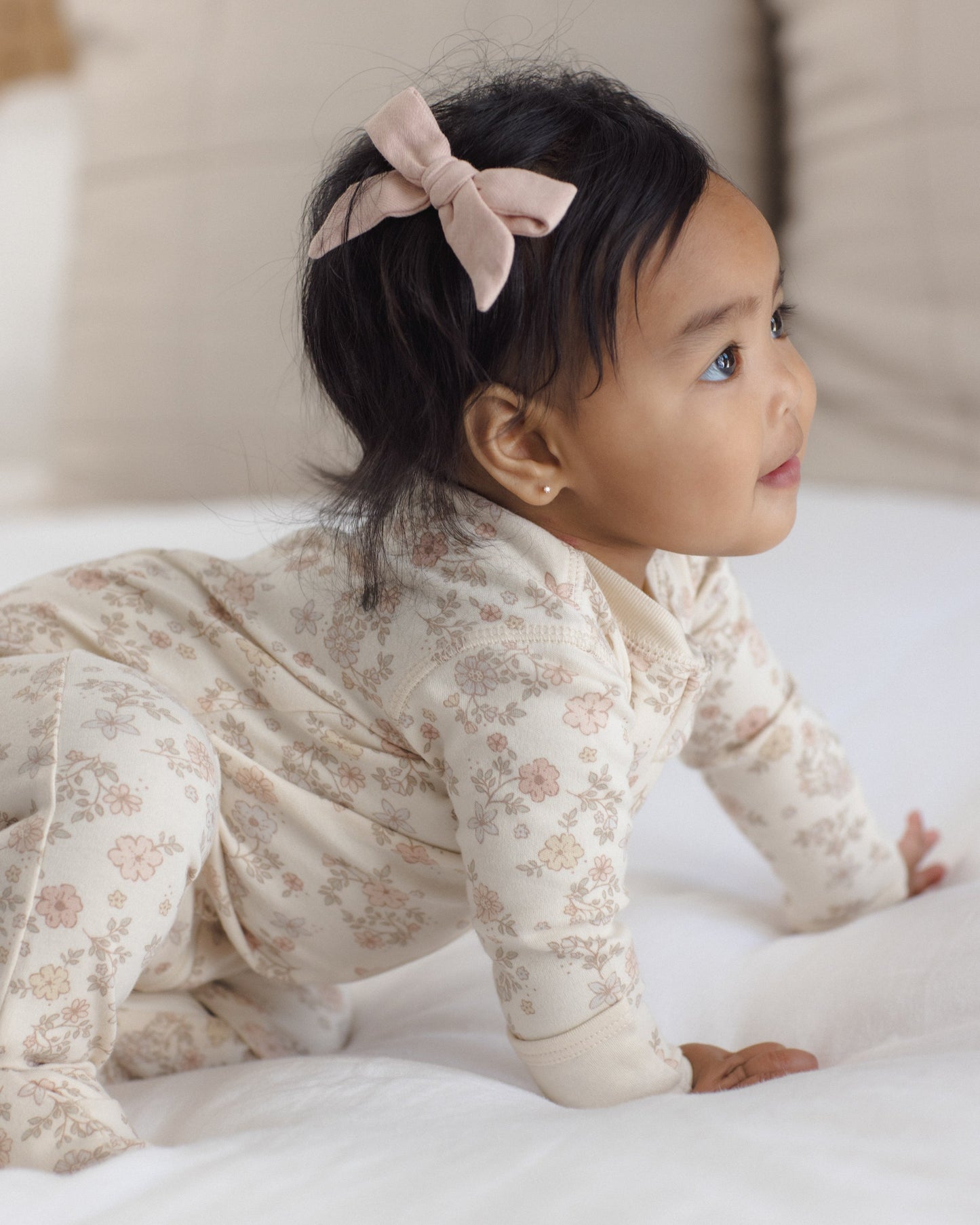 Baby in Floral Vine Zip Footie, lifestyle photo