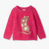 Pink sweater with a mountain lion design 