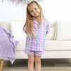 Young girl in a plaid pastel pajama set
