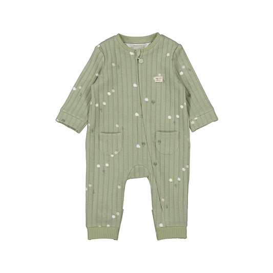 Green baby romper with white patterns on a white background