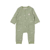 Green baby romper with white patterns on a white background