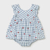 Blue checkered baby romper with red floral patterns on a light gray background