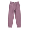 A pair of dusty purple sweatpants featuring a small heart-shaped patch on the upper left thigh.