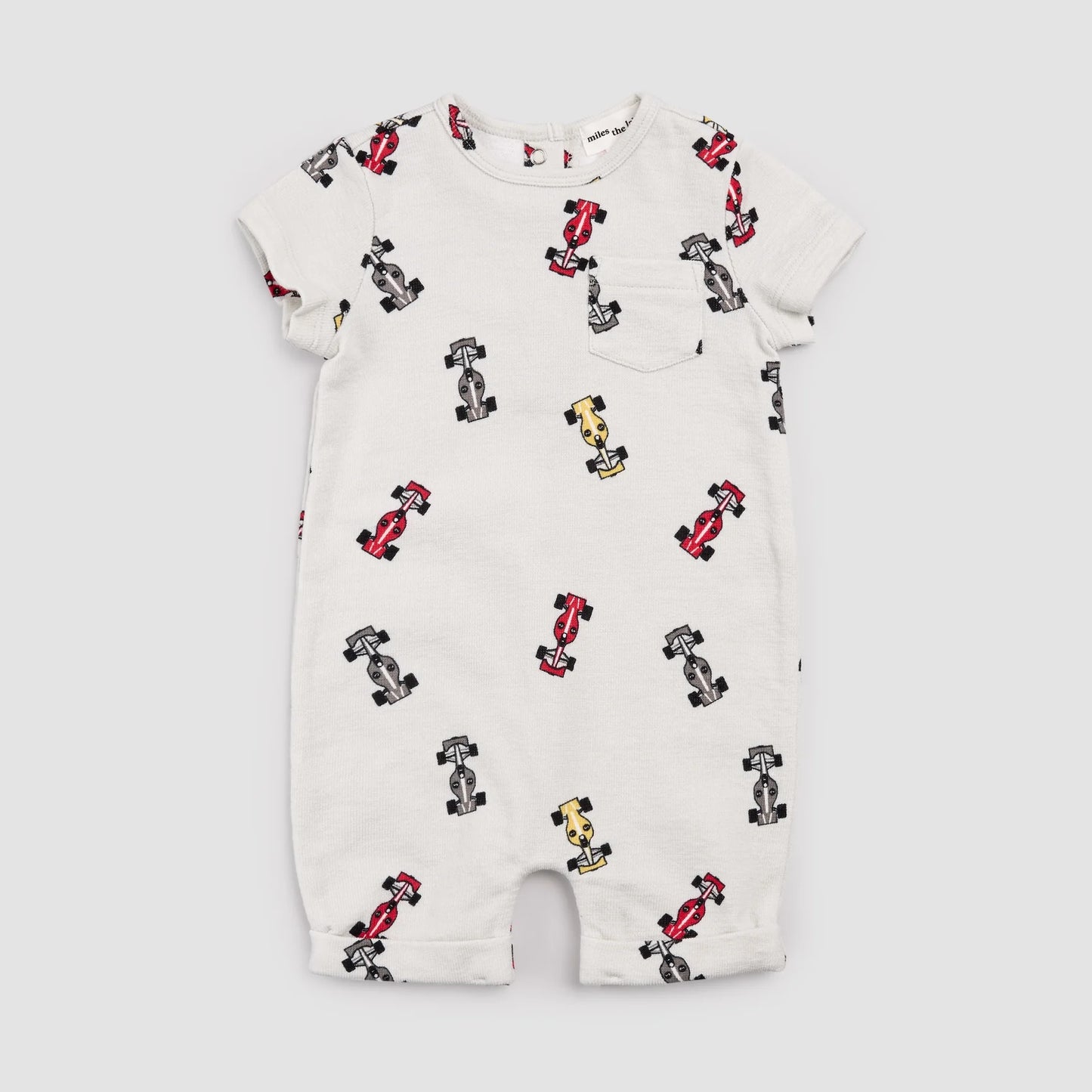 Baby romper with car pattern on a white background