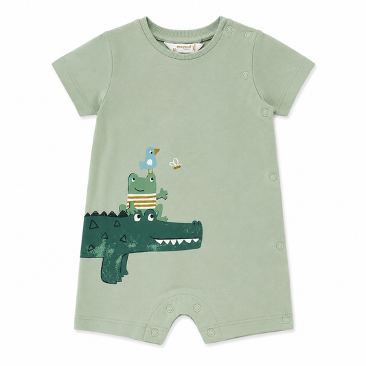 Green baby romper with alligator, frog, and bird design on a white background