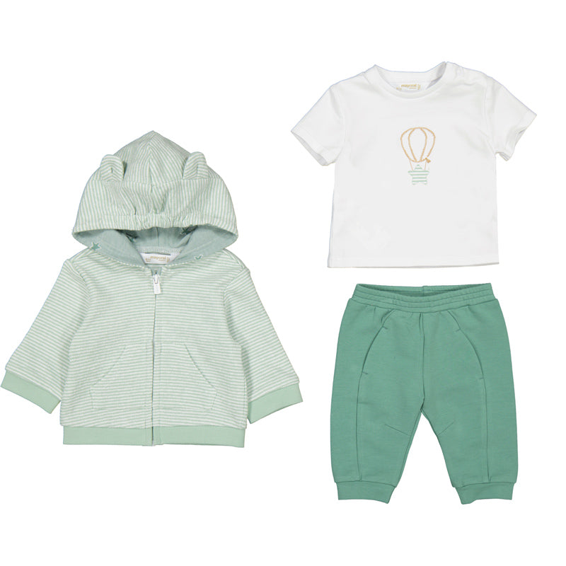 baby's outfit set with green jacket, white t-shirt with balloon design, and green pants on a white background