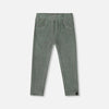 Green ribbed leggings on a light gray background