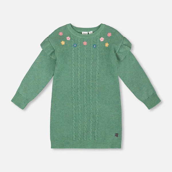 Green sweater dress with floral embroidery on a light gray background