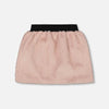 Pink skirt with black waistband on a light gray background