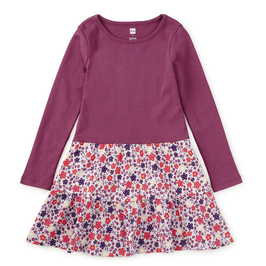 Purple dress with a floral skirt on a white background