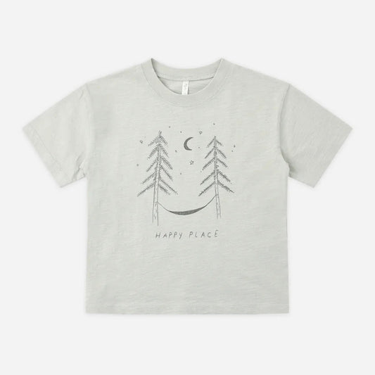 A light gray heather short-sleeve t-shirt with a dark gray graphic of two pine trees, a crescent moon, stars, and the text 'HAPPY PLACE' on the front, displayed flat against a light gray background.