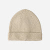 A light beige ribbed knit beanie hat centered on a plain light gray background.