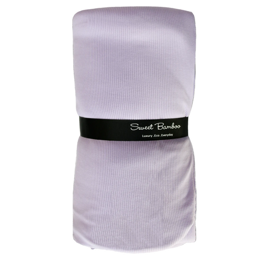 Folded towel with 'Sweet Bamboo' label on a white background
