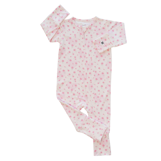 Pink baby onesie with a subtle pattern on a white background