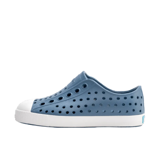 Blue shoe with white sole on a white background