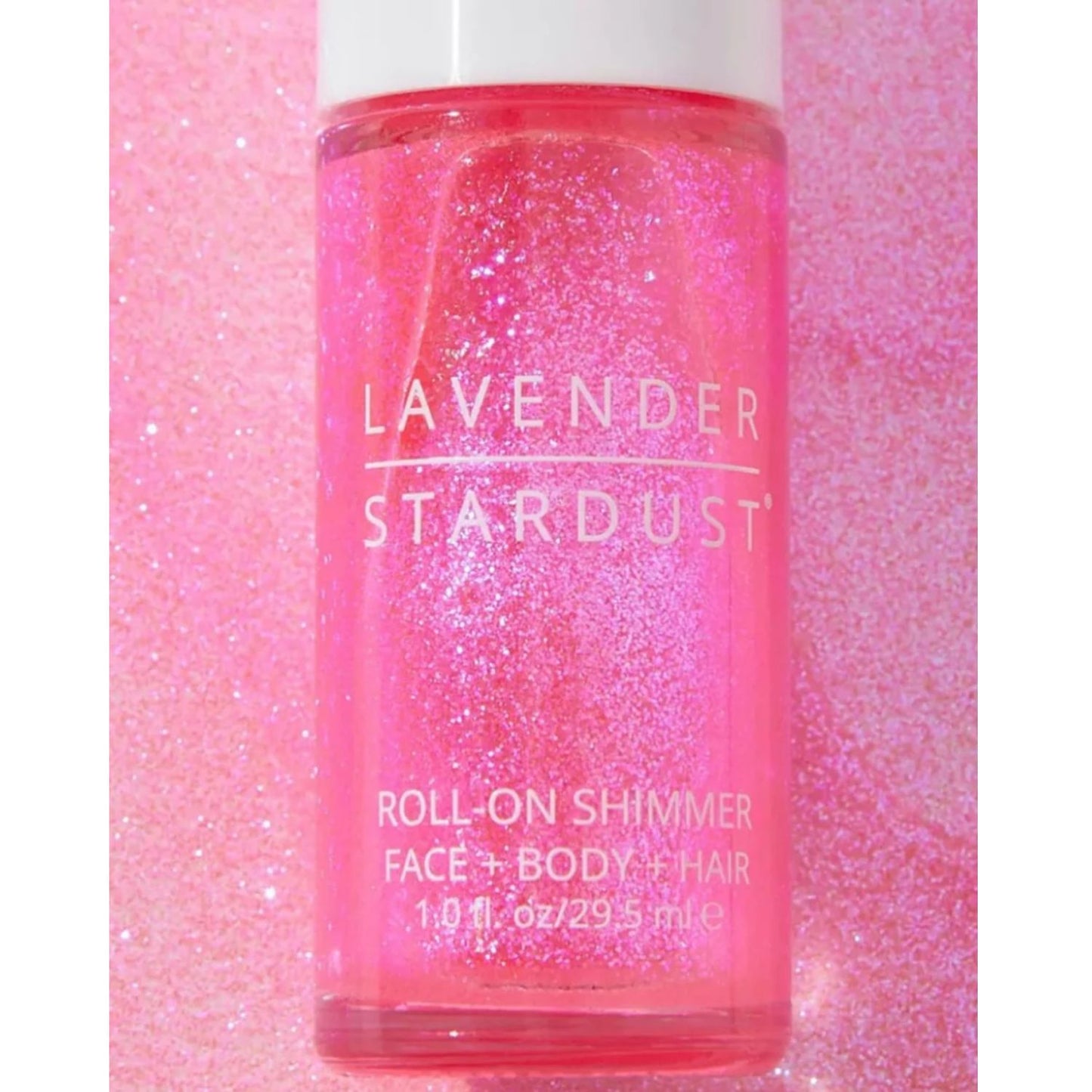 Iridescent pink roll-on shimmer for face and body