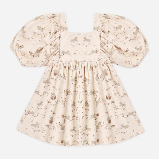 A baby girl's dress with puff sleeves, a square neckline, and a smocked bodice, featuring a delicate beige and brown floral print on a cream background.