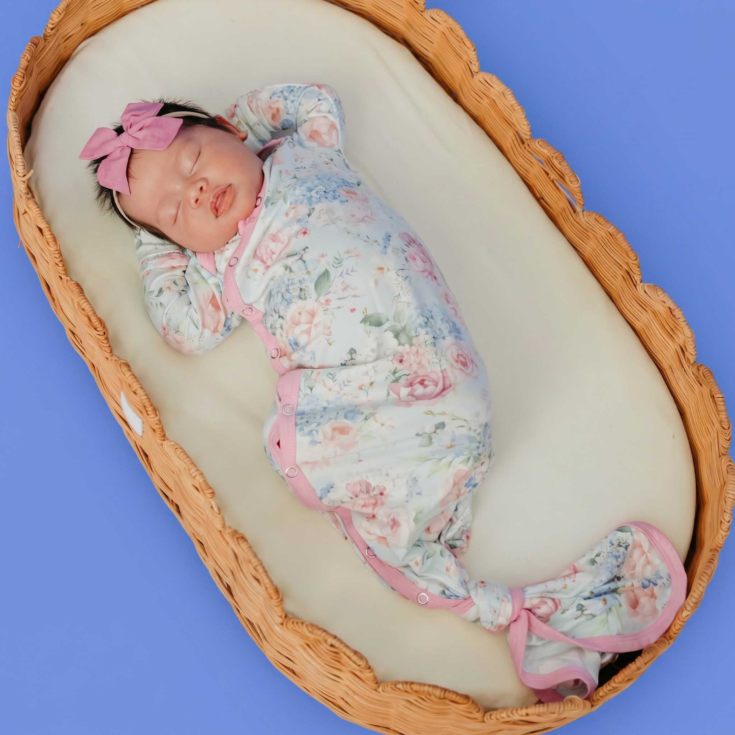 Floral baby knotted gown with pink trim and snaps