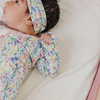 Floral baby knotted gown with pink trim and snaps